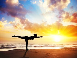 Yoga silhouette on the beach